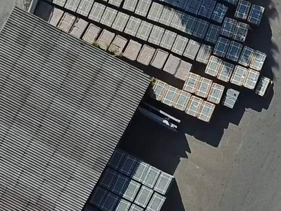 Finished goods stock from above: even rows of packed pallets