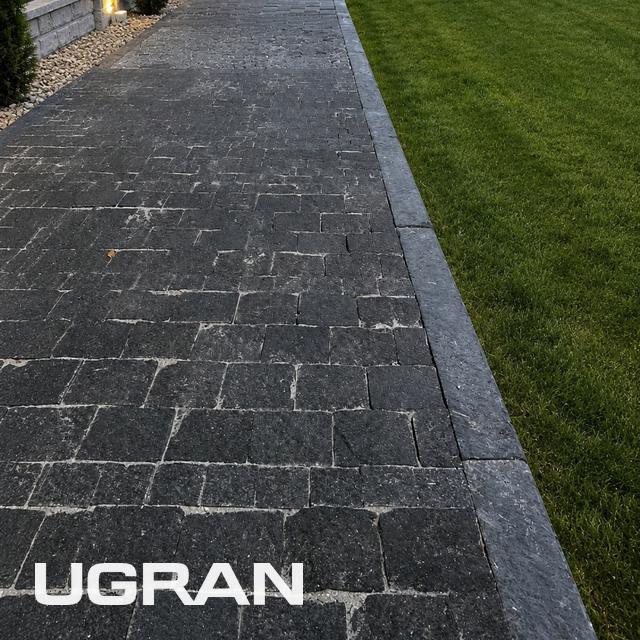 Labradorite setts paving with a kerb line along the edge